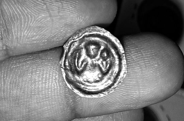 A bracteate: silver so thin it was struck on one side only. This Magdeburg example of c.1200 is 32 mm across and weighs 0.75 grams